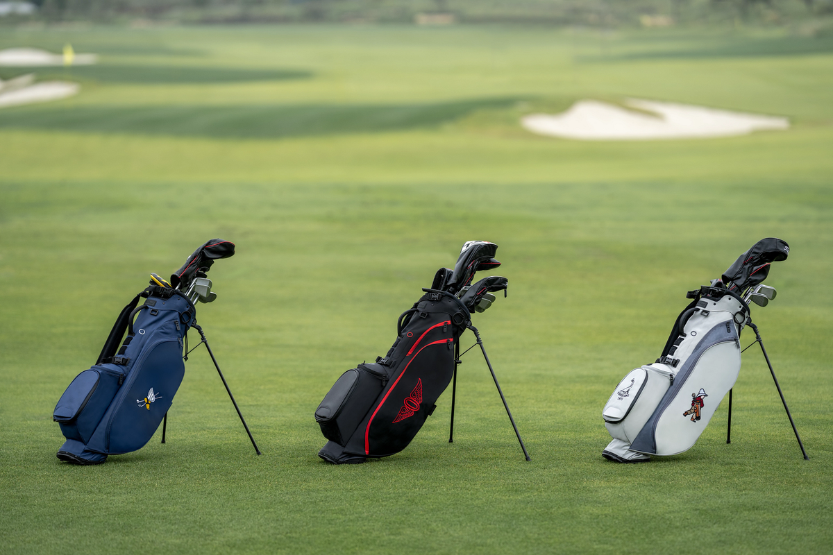A comparison of different golf stand bags on a course, helping players choose the best bag for walking or riding.