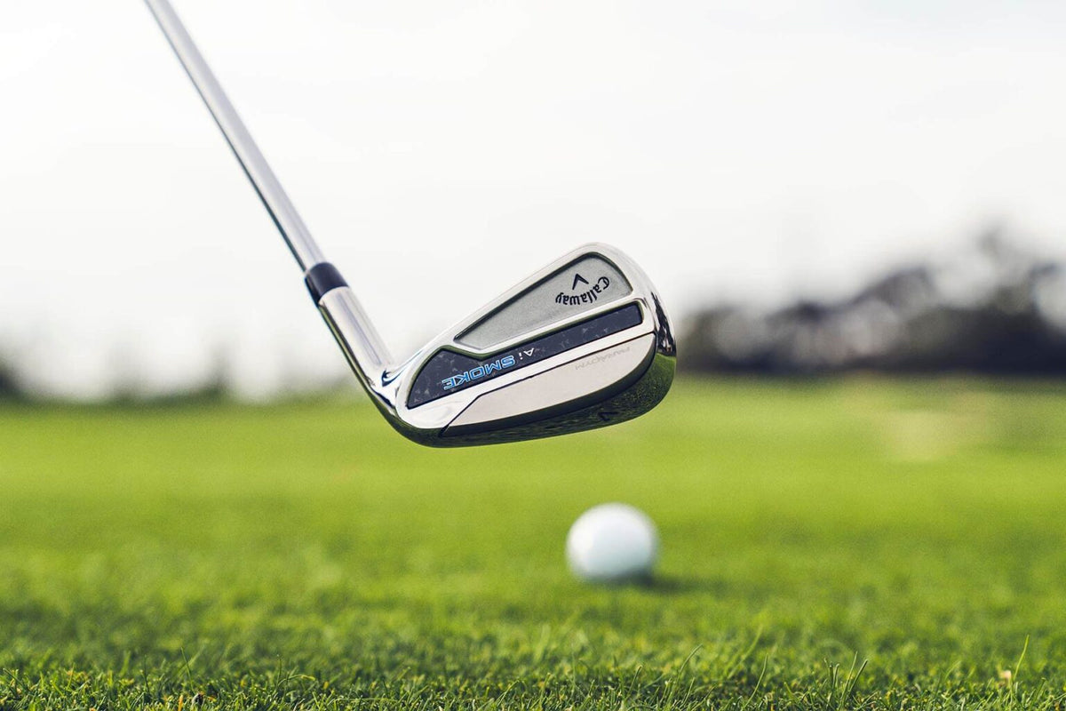Iron striking the ball, highlighting clean turf interaction and the precision golfers look for when comparing iron sets.