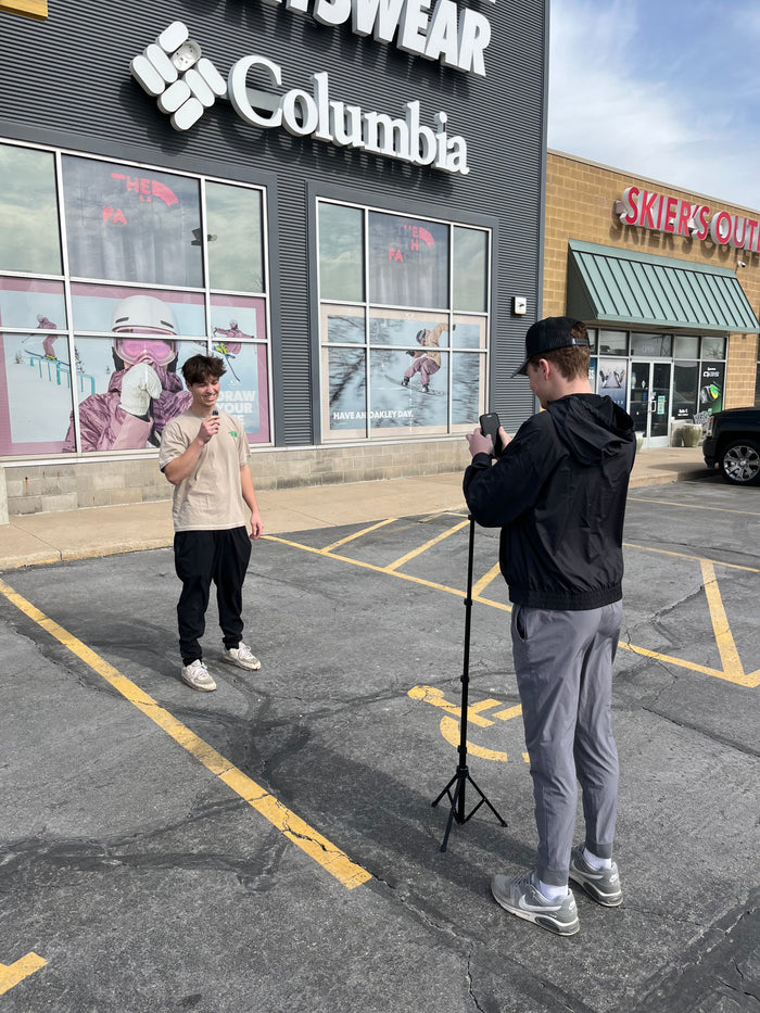 An employee filming a marketing intern video outside Golfer's & Skier's Outlet retail store in northeast Wisconsin.