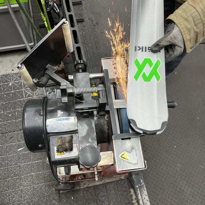 Precision ski edging at our Oshkosh, WI shop; professional machine tuning for better grip on the slopes.