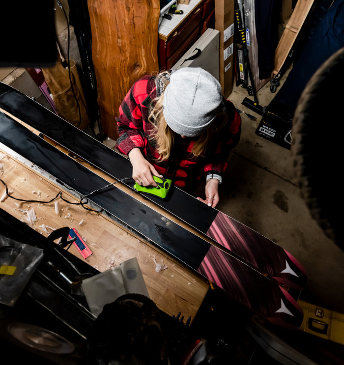 Traditional hot waxing for skis in Wisconsin; protecting your base with a thick storage layer for the off-season.